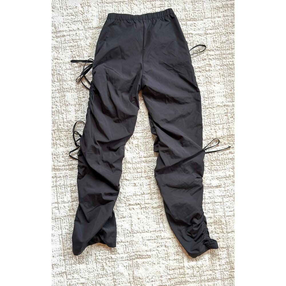 SHEIN windbreaker style black pants.